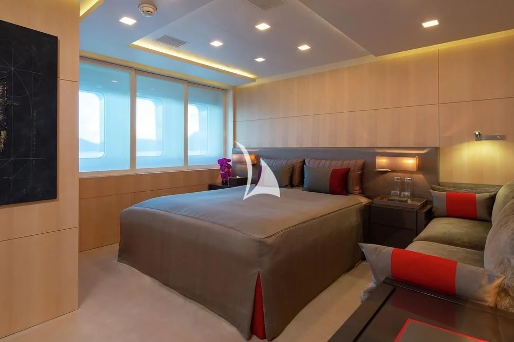 a room with a bed and a tv aboard SIREN Yacht for Sale