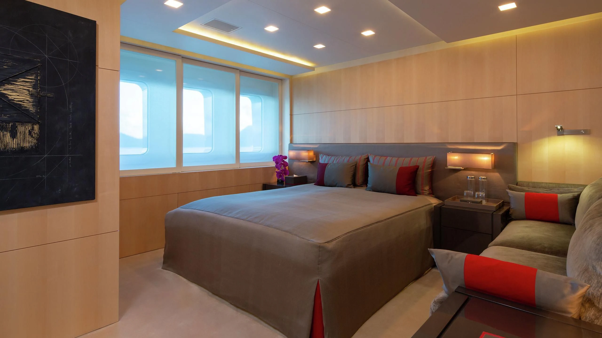 a bedroom with a bed and a couch aboard SIREN Yacht for Sale