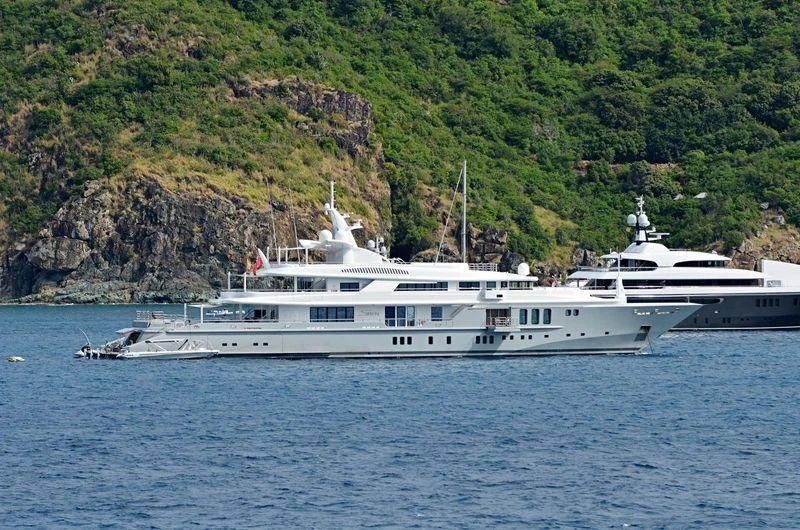 a couple of boats on the water aboard SIREN Yacht for Sale