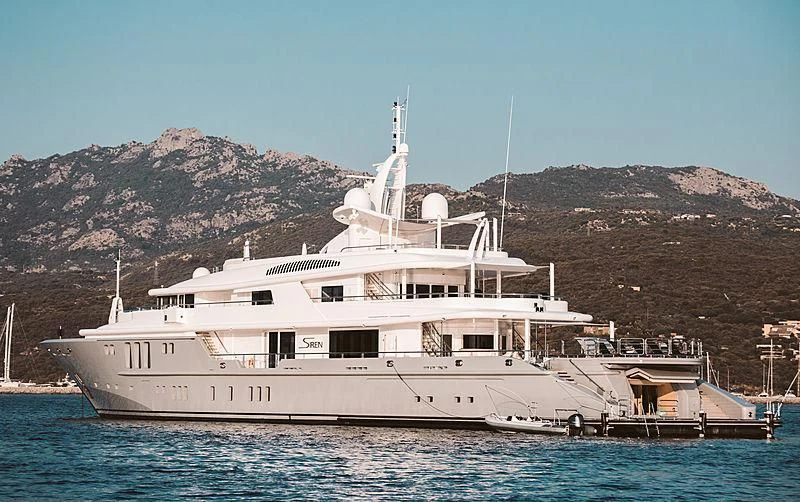 a large white ship in the water aboard SIREN Yacht for Sale