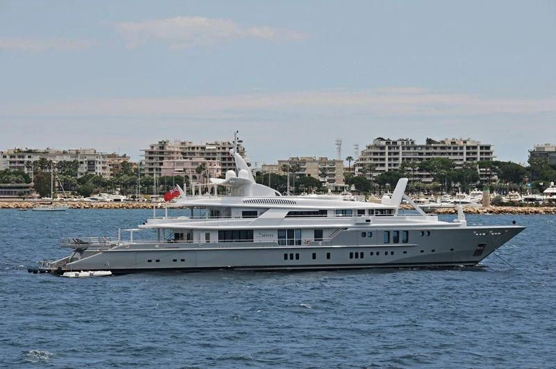 a large white boat in the water aboard SIREN Yacht for Sale