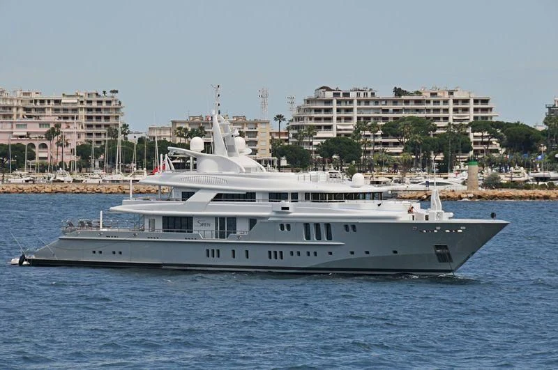 a large white boat in the water aboard SIREN Yacht for Sale