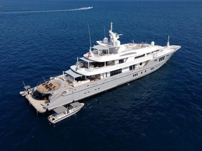 a large ship in the water aboard SIREN Yacht for Sale