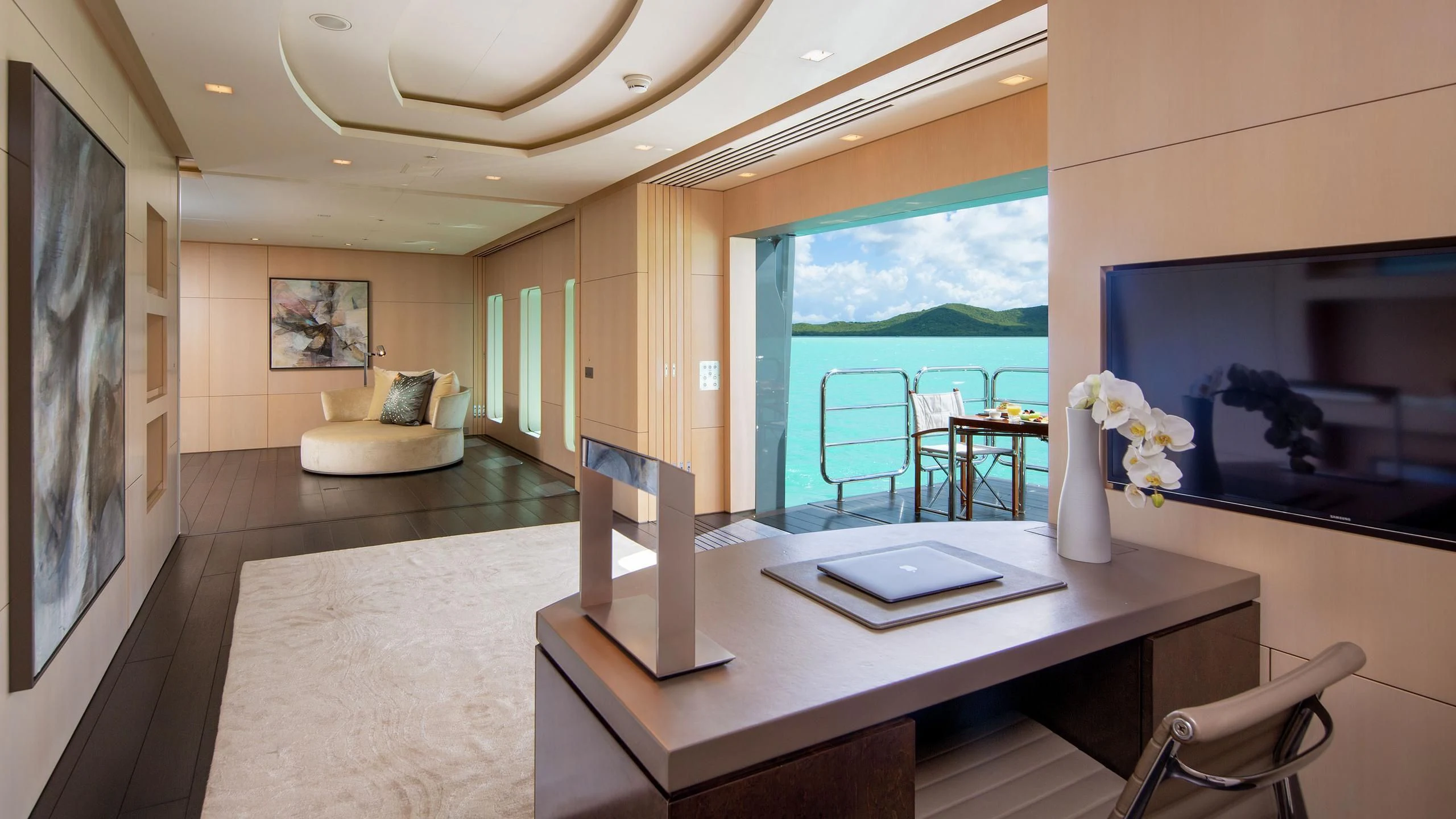 a room with a table and chairs aboard SIREN Yacht for Sale