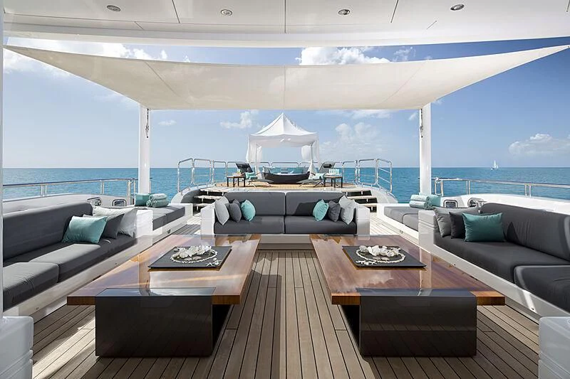 a living room with a large body of water aboard SIREN Yacht for Sale