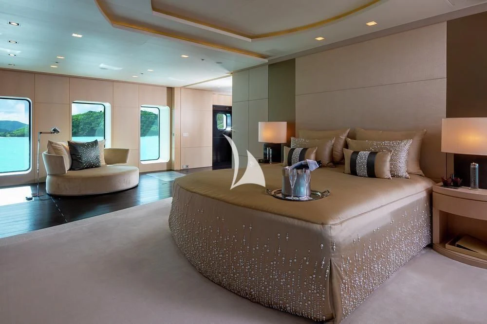 a large bedroom with a large bed aboard SIREN Yacht for Sale