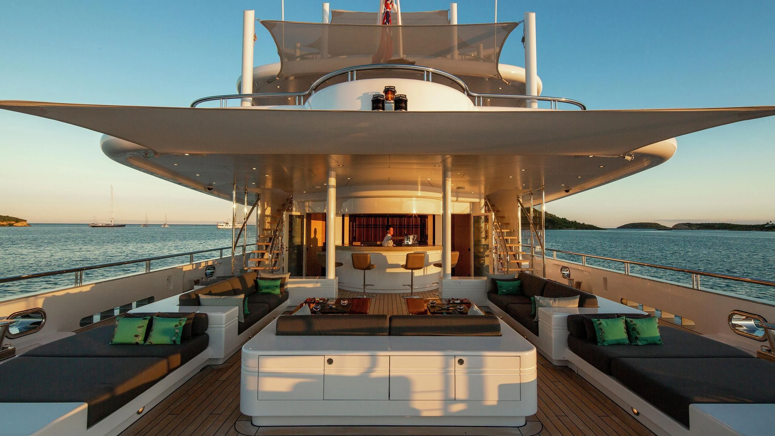 a large open space with a pool and a deck aboard SIREN Yacht for Sale