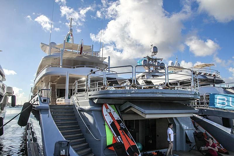 a boat docked with a staircase aboard SIREN Yacht for Sale