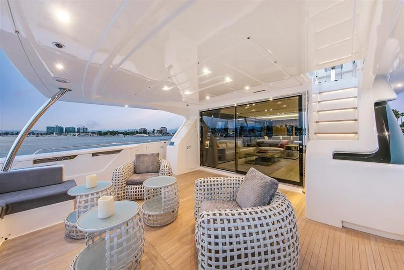 a living room with a large balcony aboard LONTANO Yacht for Sale