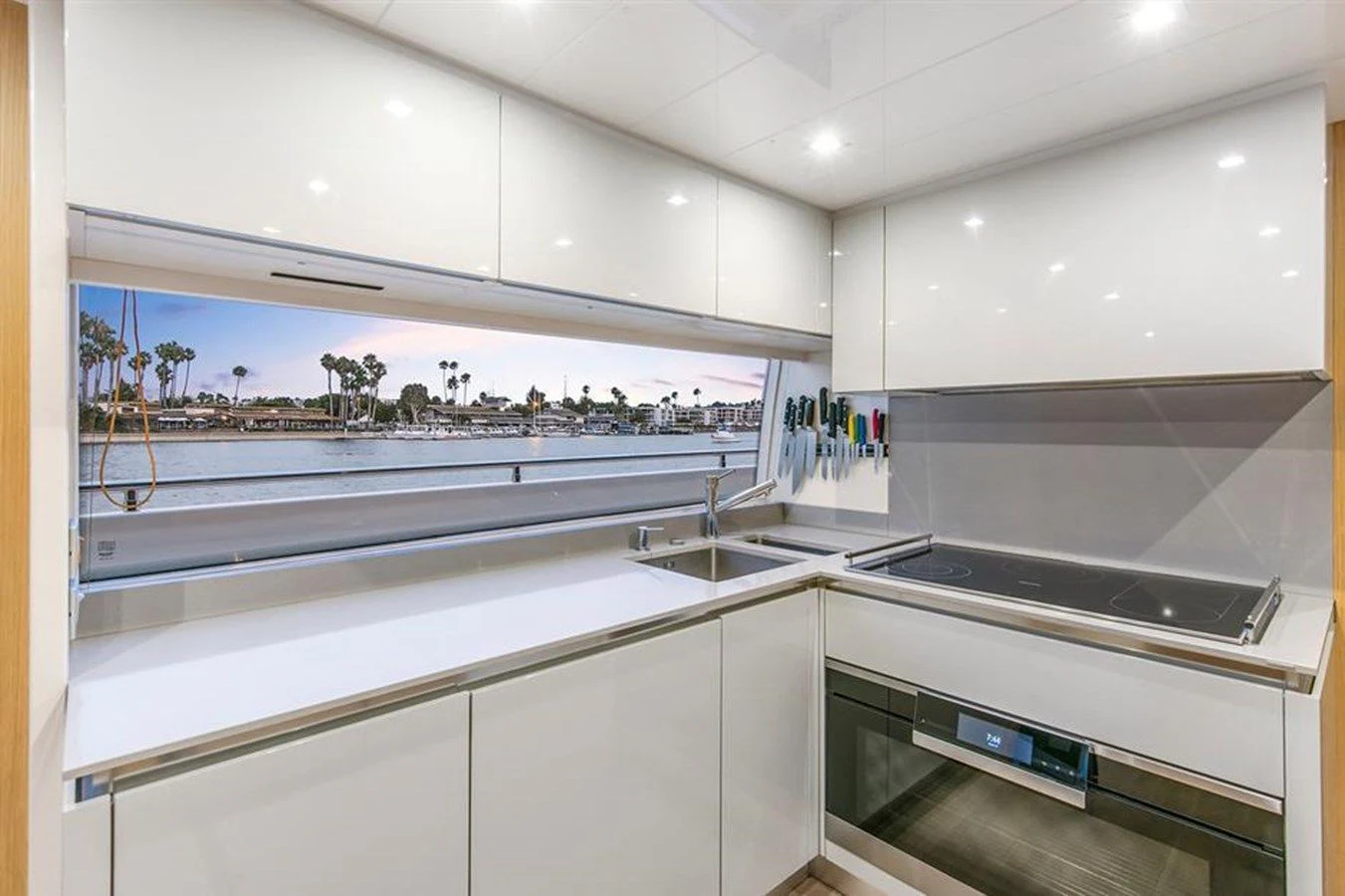 a kitchen with a large window aboard LONTANO Yacht for Sale