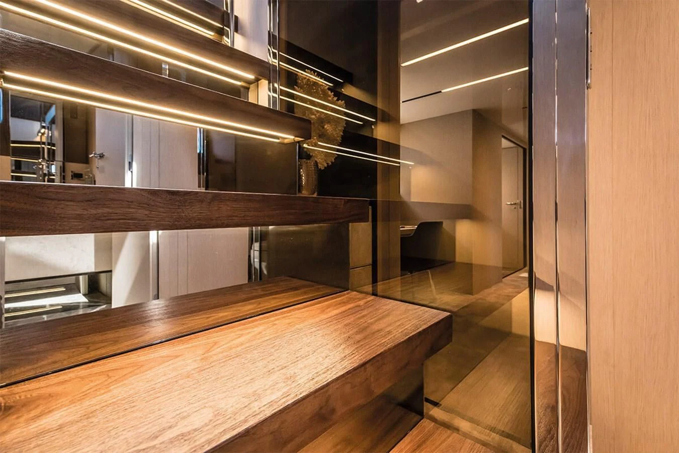 a room with shelves and cabinets aboard SESSANTASETTE 67 Yacht for Sale