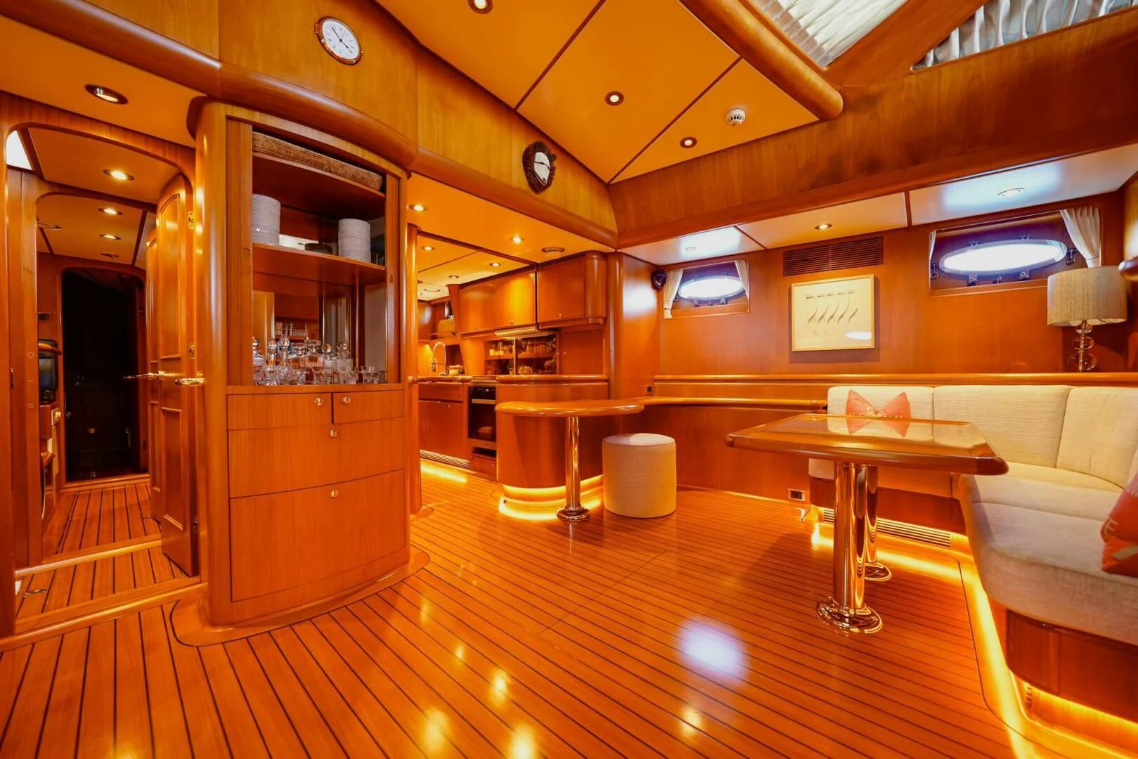 a room with a wood floor and a wood cabinet and a table aboard JERSEY PEARL Yacht for Sale