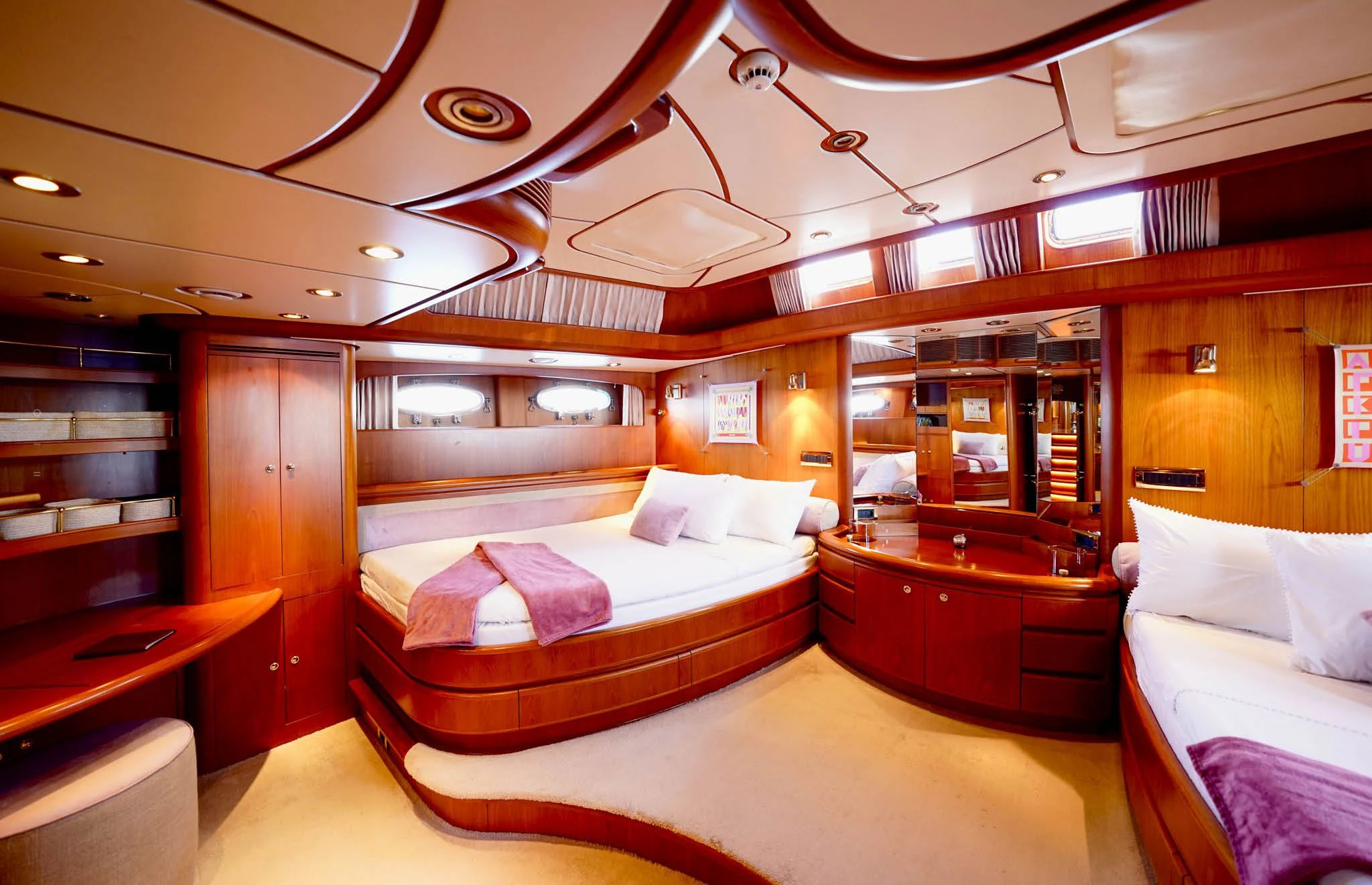 a room with a bed and a desk aboard JERSEY PEARL Yacht for Sale