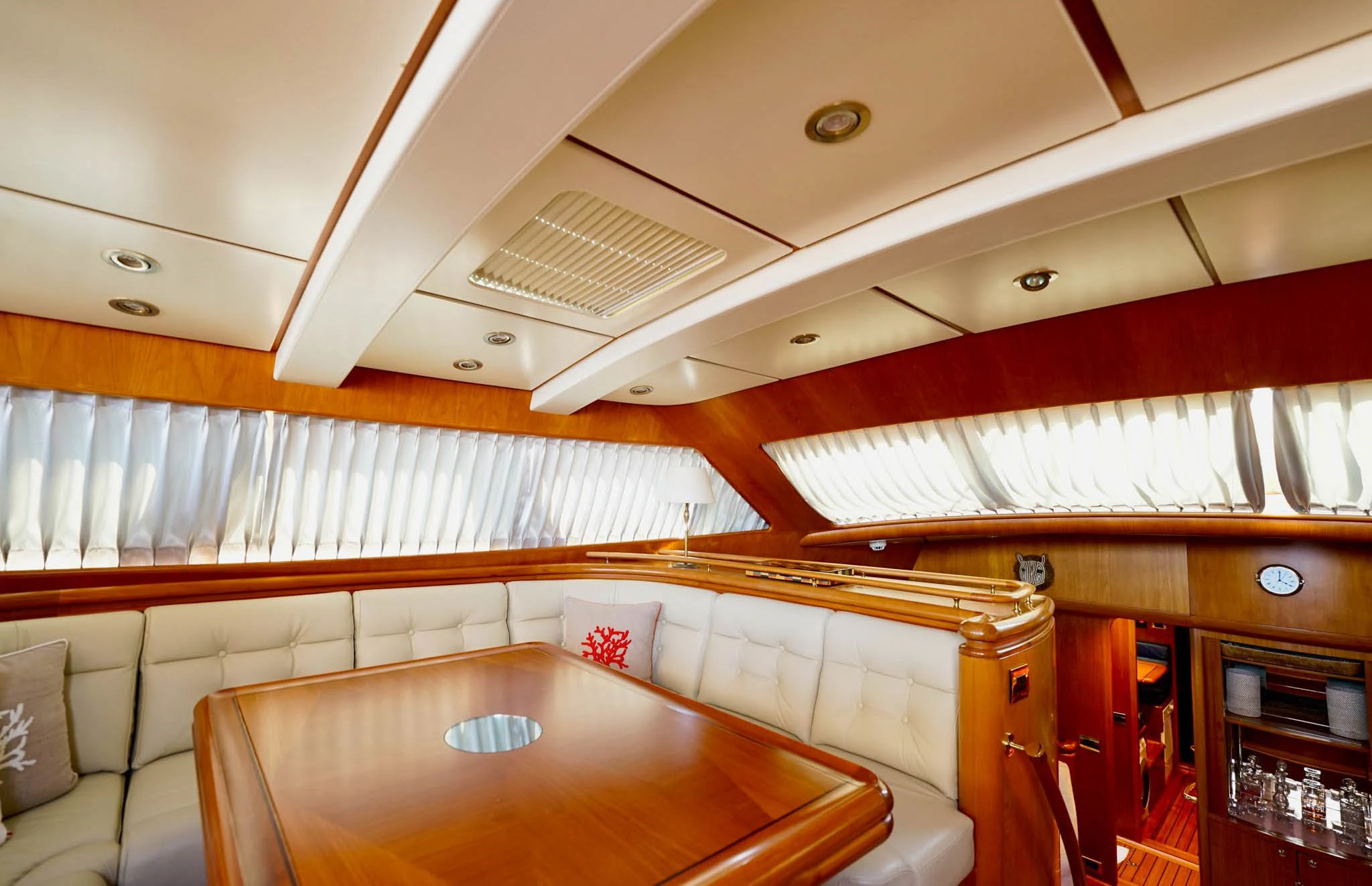 a room with a table and chairs aboard JERSEY PEARL Yacht for Sale