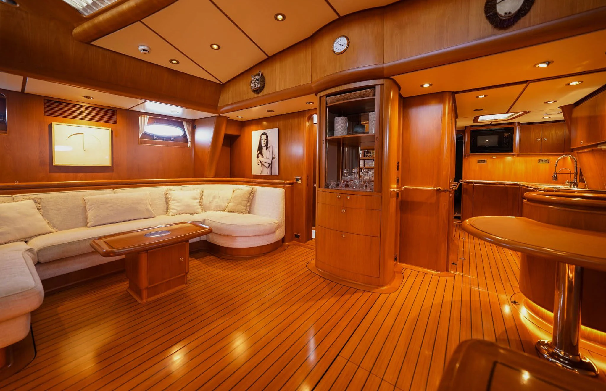 a living room with a wood floor aboard JERSEY PEARL Yacht for Sale