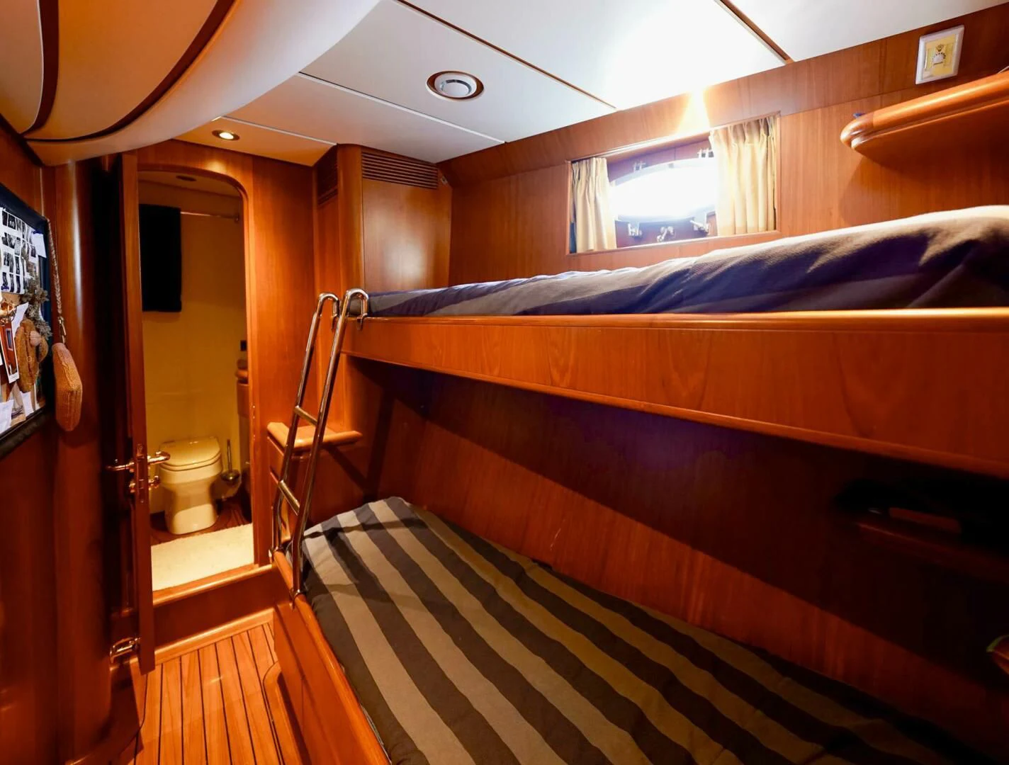 a bunk bed with a ladder aboard JERSEY PEARL Yacht for Sale