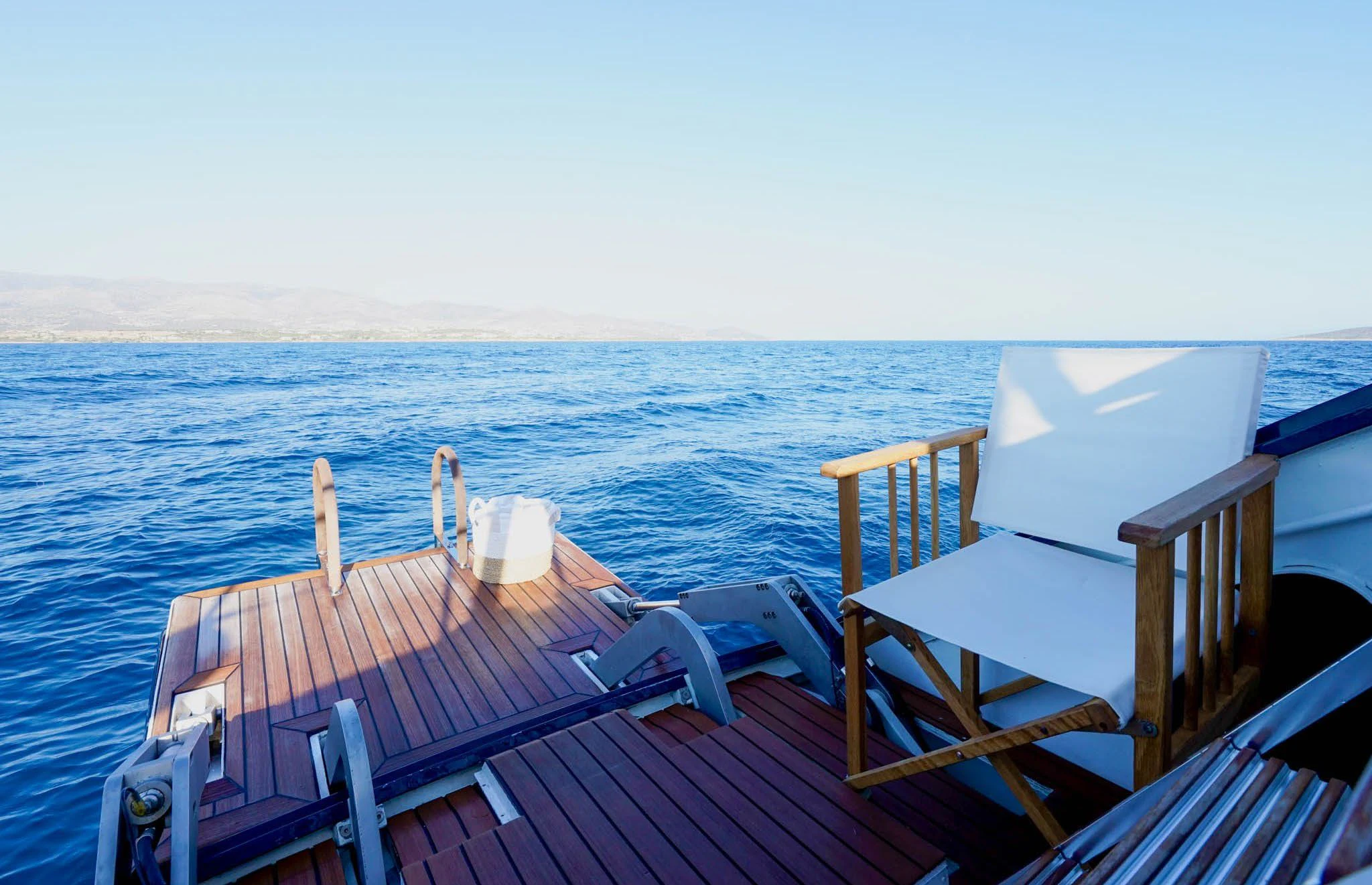 a deck with chairs on it by the water aboard JERSEY PEARL Yacht for Sale