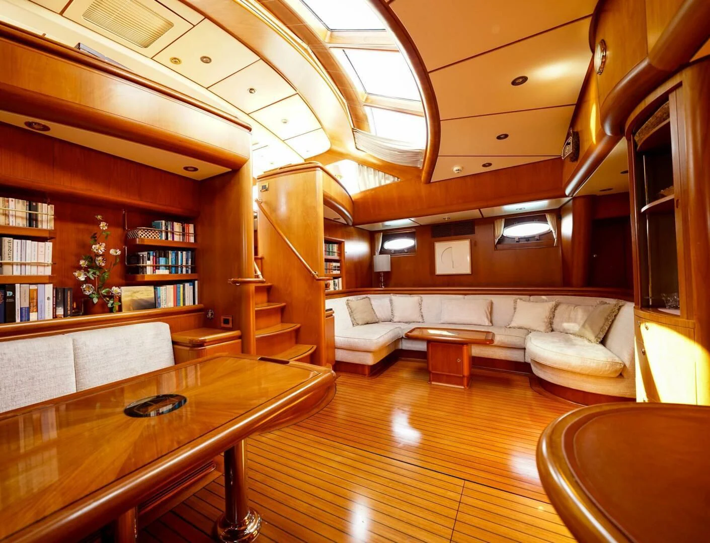 a room with a couch and a table aboard JERSEY PEARL Yacht for Sale