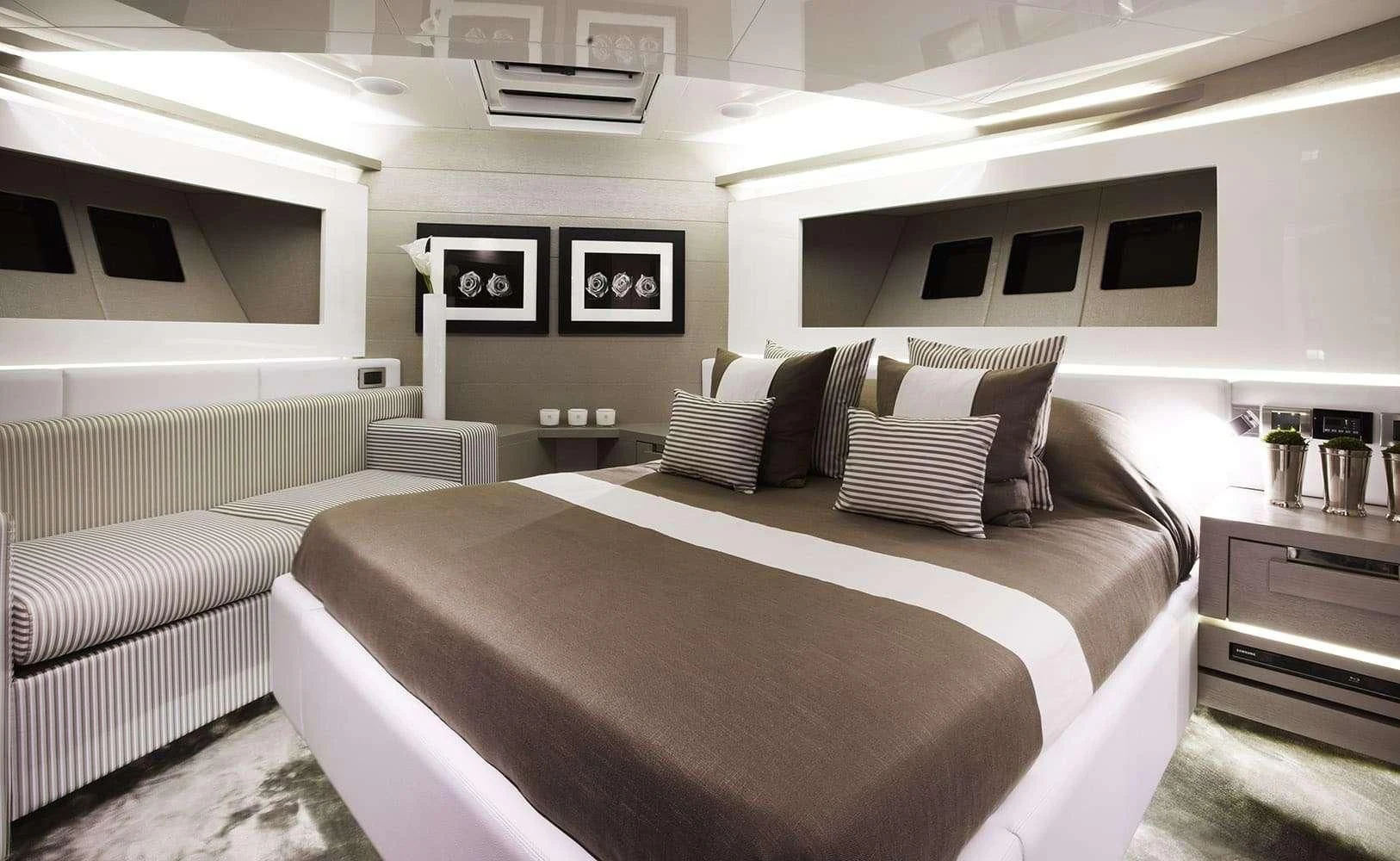 a room with a bed and a couch aboard FINALLY Yacht for Charter