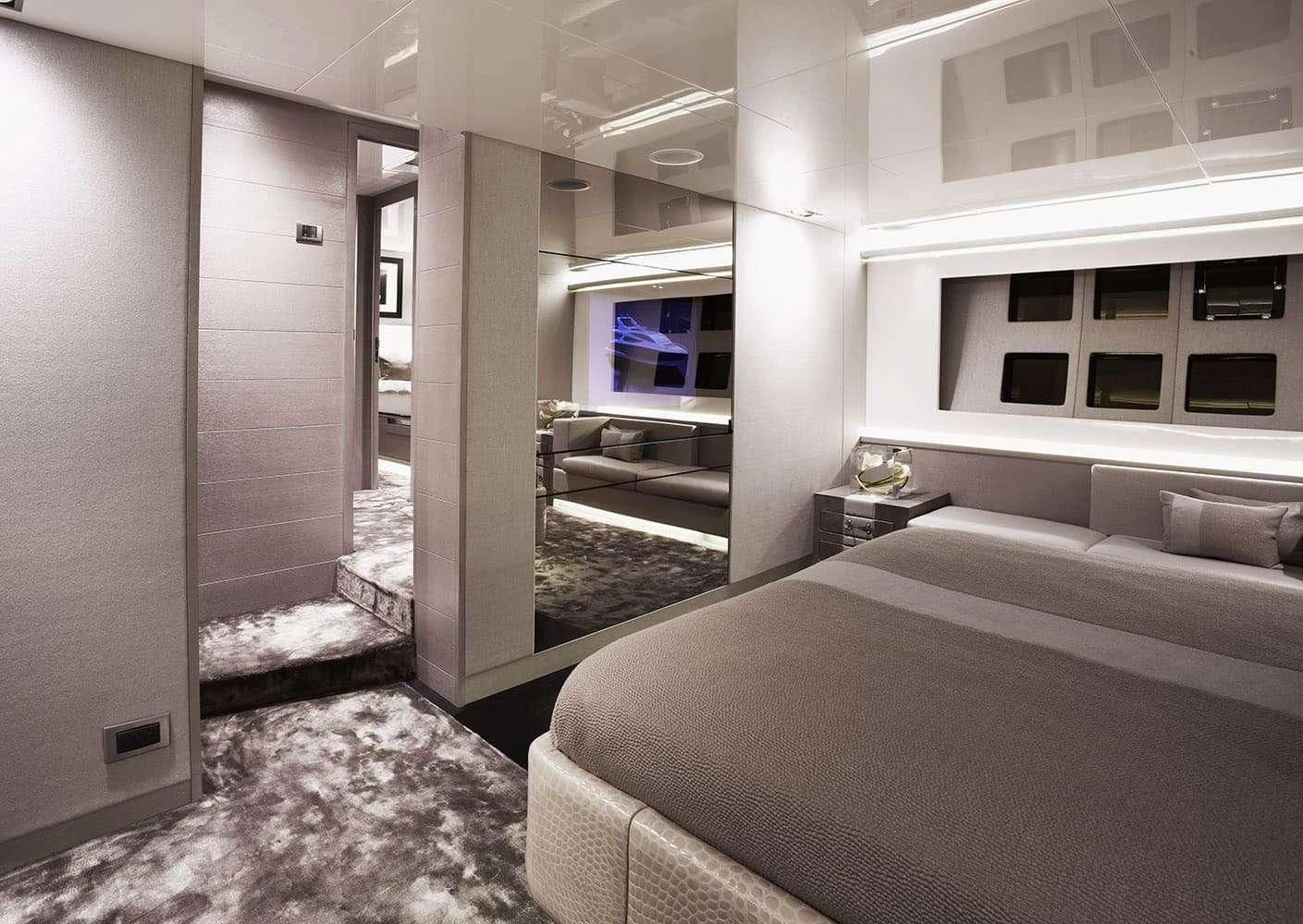 a room with a bed and a tv aboard FINALLY Yacht for Charter