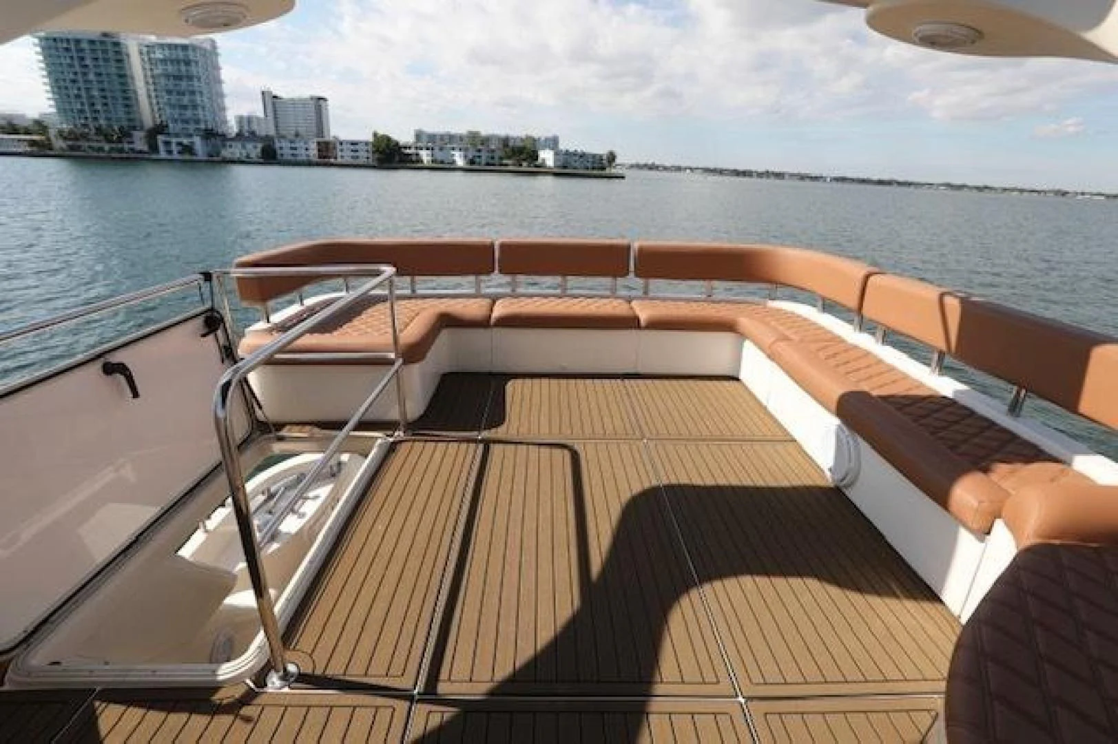 a deck with chairs on it by a body of water aboard K3 Yacht for Sale