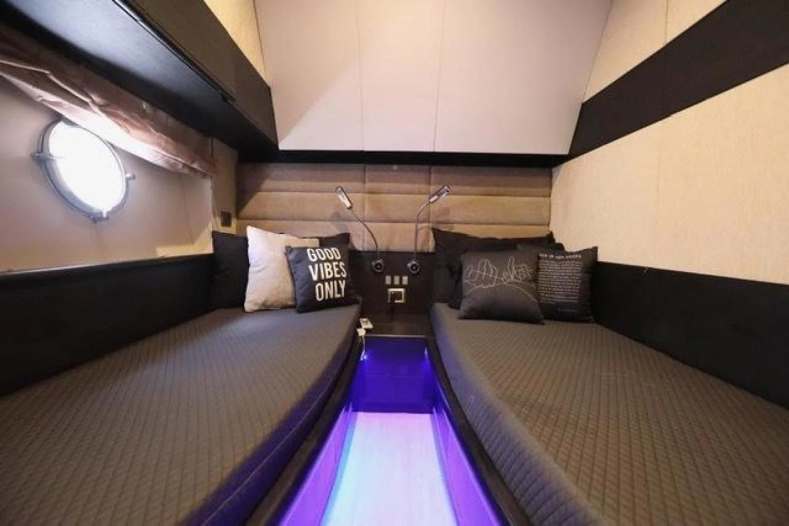 a room with a bed and a window aboard K3 Yacht for Sale