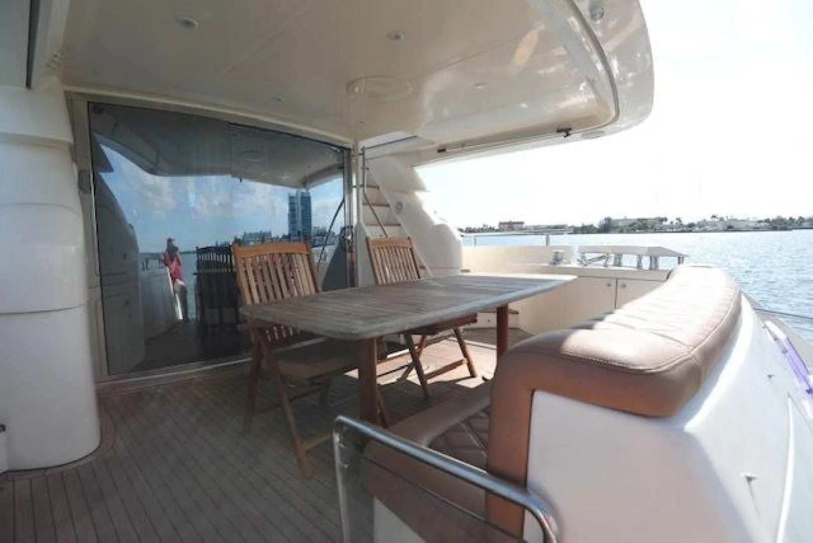 a boat with a table and chairs aboard K3 Yacht for Sale