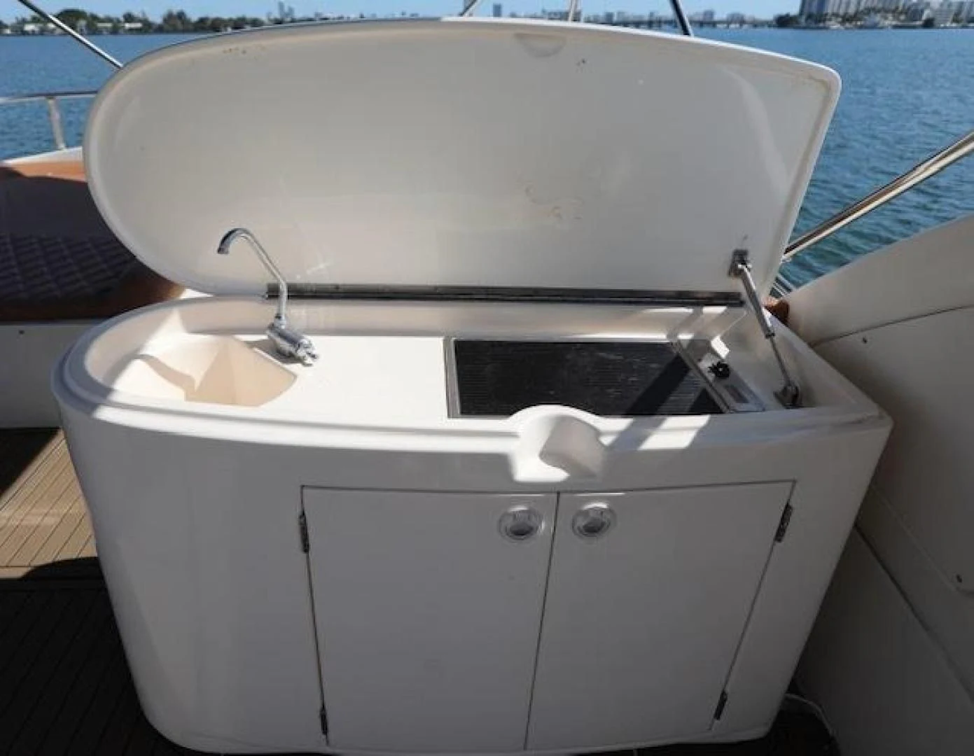 a white sink with a faucet on it aboard K3 Yacht for Sale