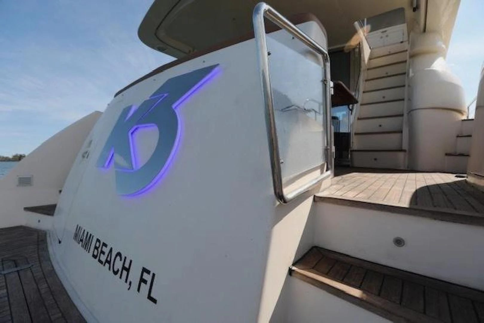 a large white box with a purple logo on it aboard K3 Yacht for Sale