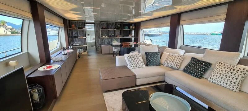 a living room with a large window aboard WATERMACHINE Yacht for Sale