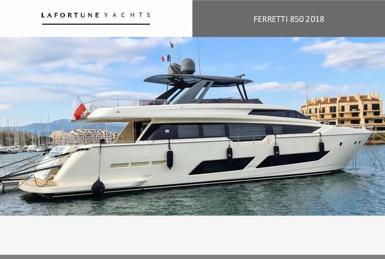 a white yacht in a harbor aboard WATERMACHINE Yacht for Sale