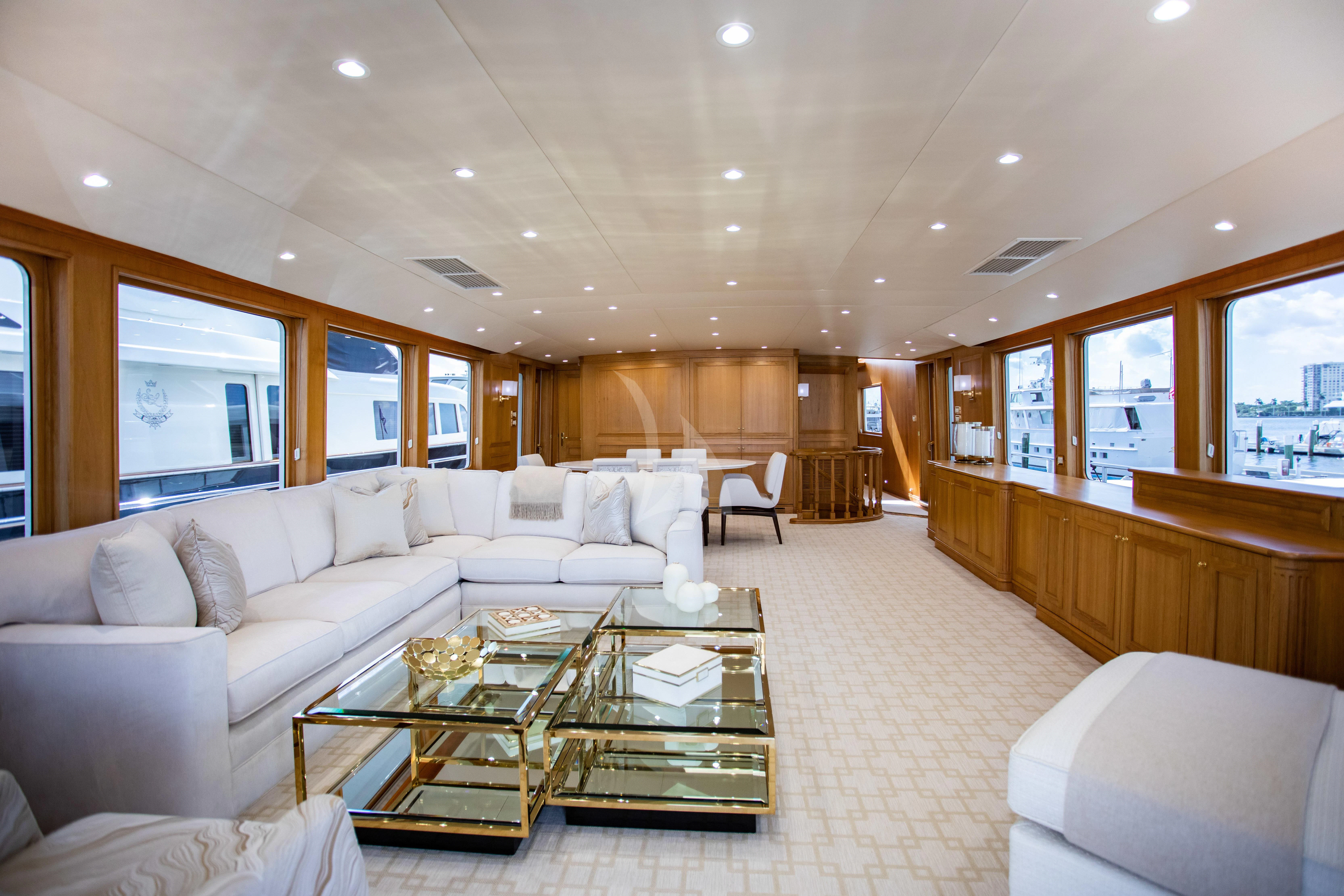 a living room with a large sofa aboard VIAGGIO Yacht for Sale