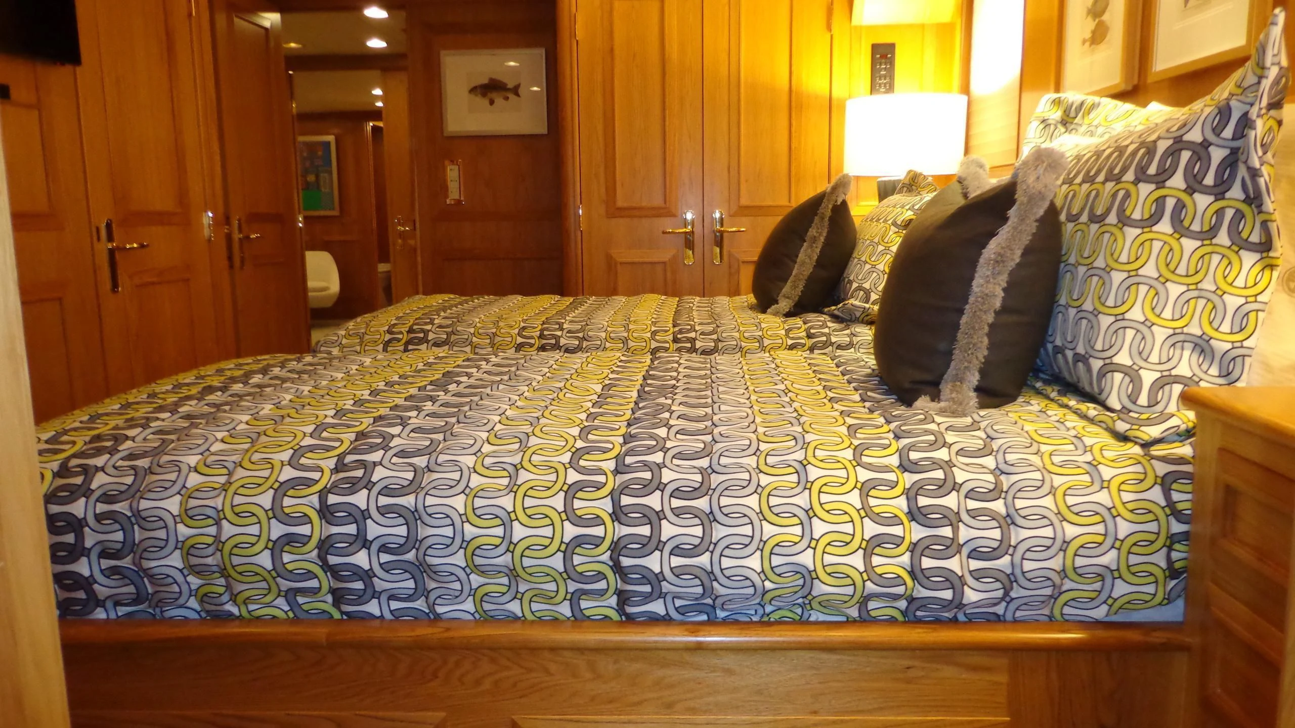 a bed with blue and white sheets aboard VIAGGIO Yacht for Sale