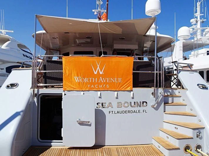 a boat with a sign on the front aboard VIAGGIO Yacht for Sale