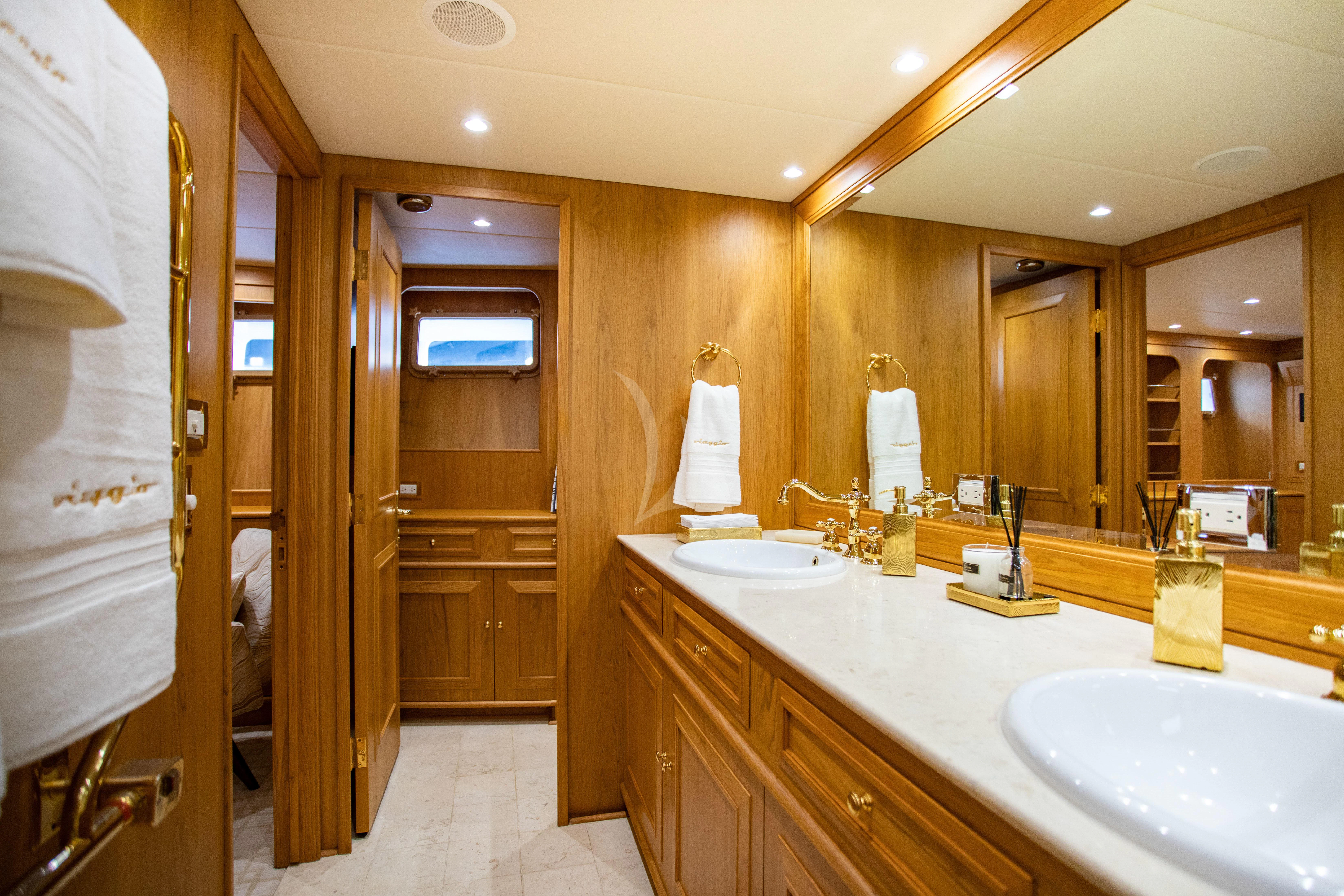 a bathroom with a large mirror aboard VIAGGIO Yacht for Sale