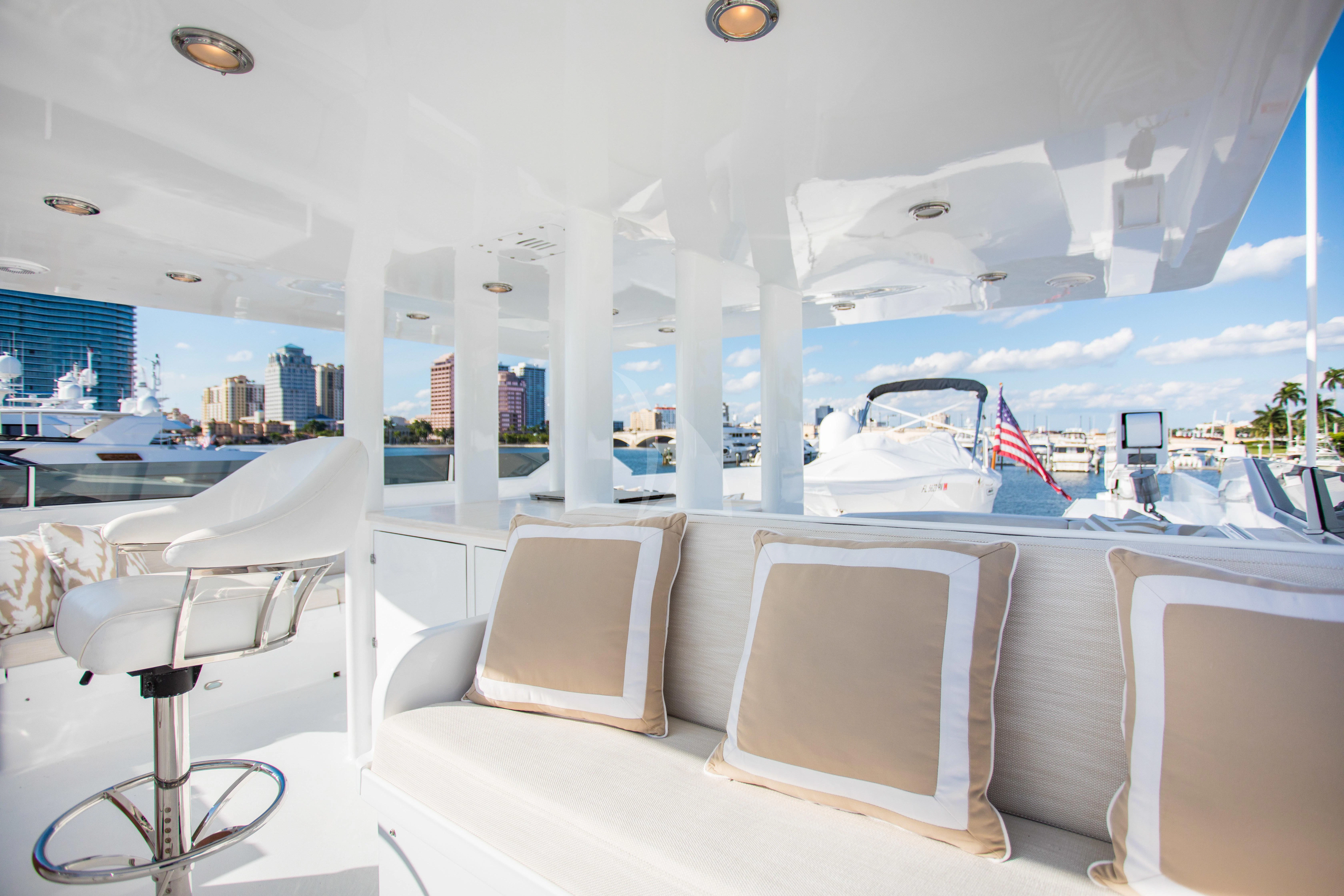 a room with a couch and chairs aboard VIAGGIO Yacht for Sale