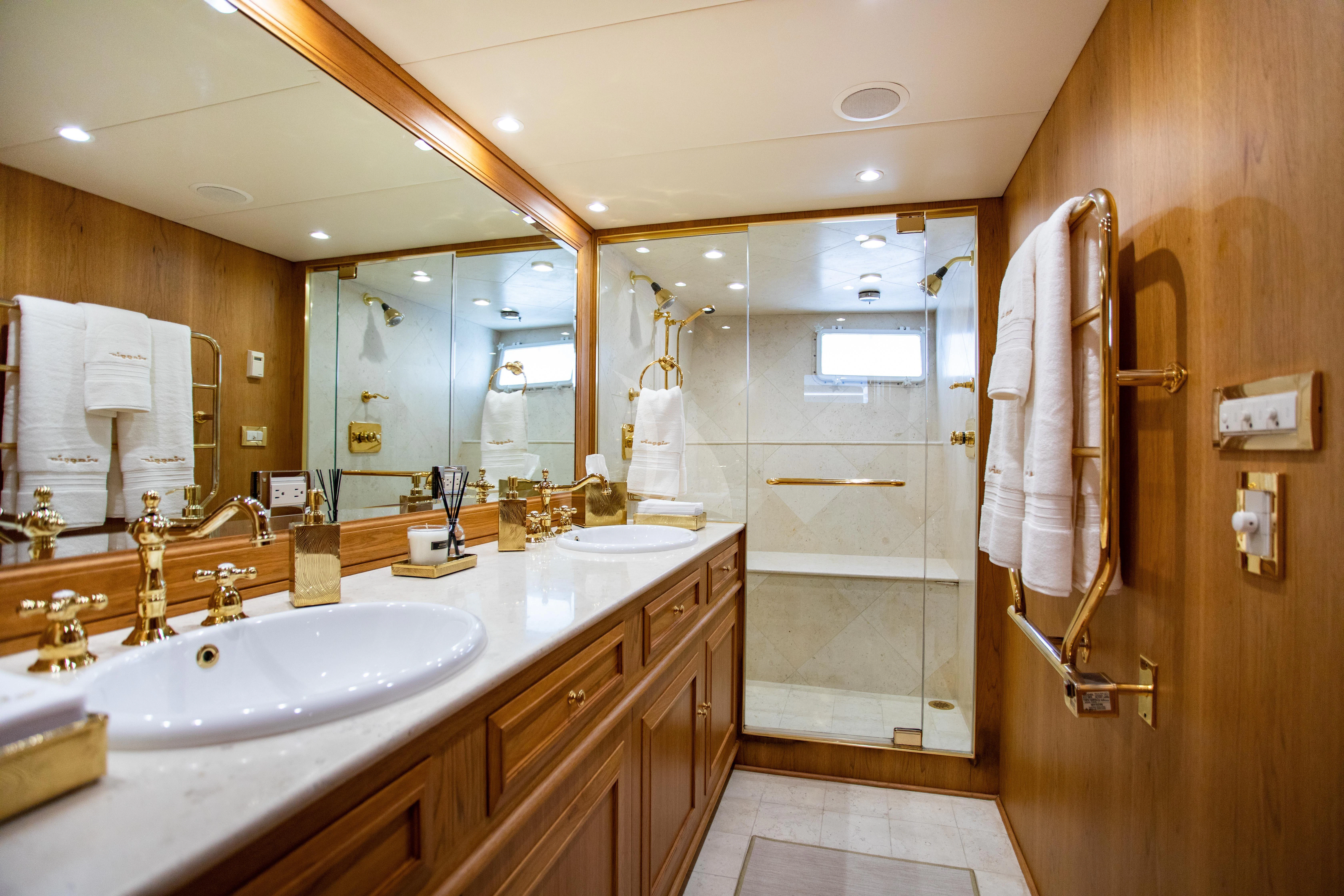 a bathroom with a large mirror aboard VIAGGIO Yacht for Sale