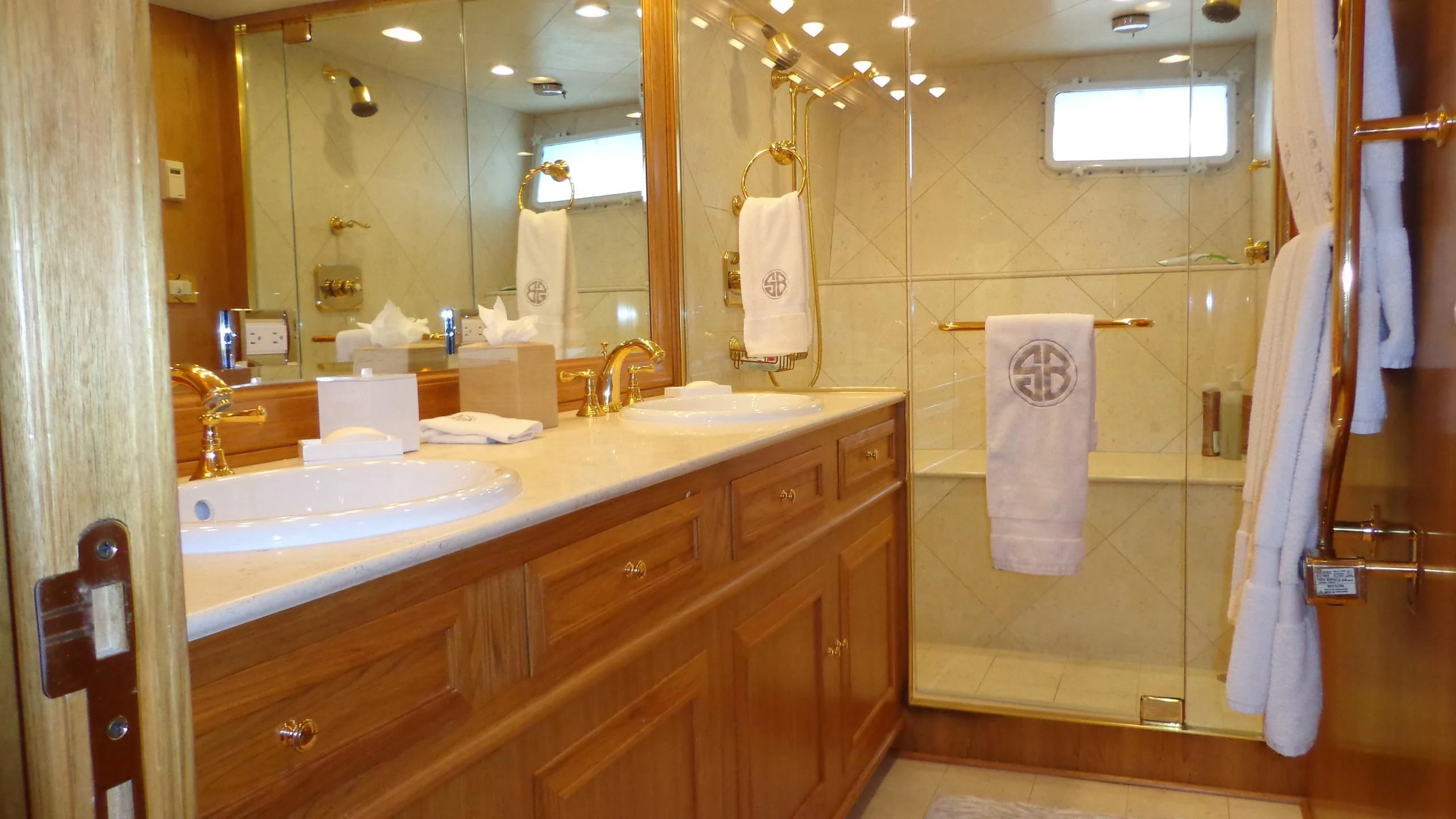 a bathroom with a large mirror aboard VIAGGIO Yacht for Sale
