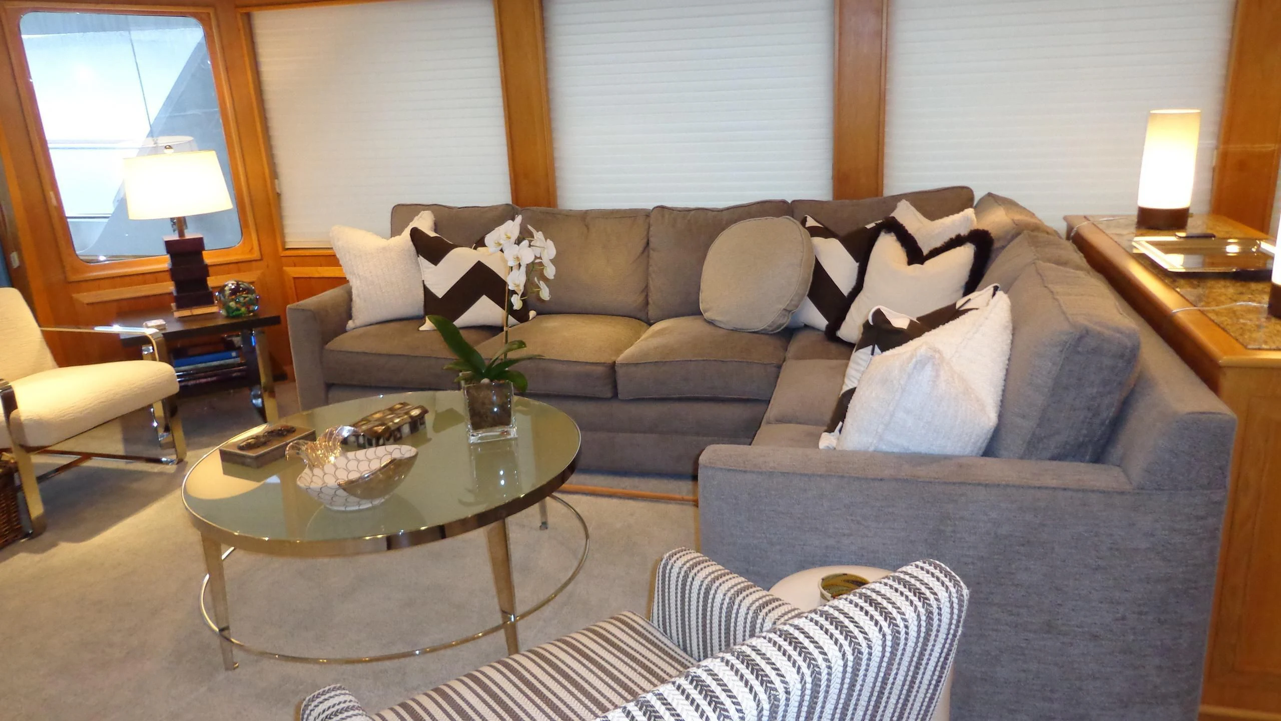 a living room with a couch and a coffee table aboard VIAGGIO Yacht for Sale