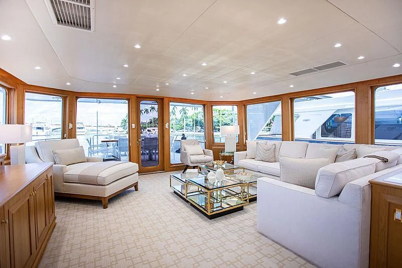 a living room with a large window aboard VIAGGIO Yacht for Sale