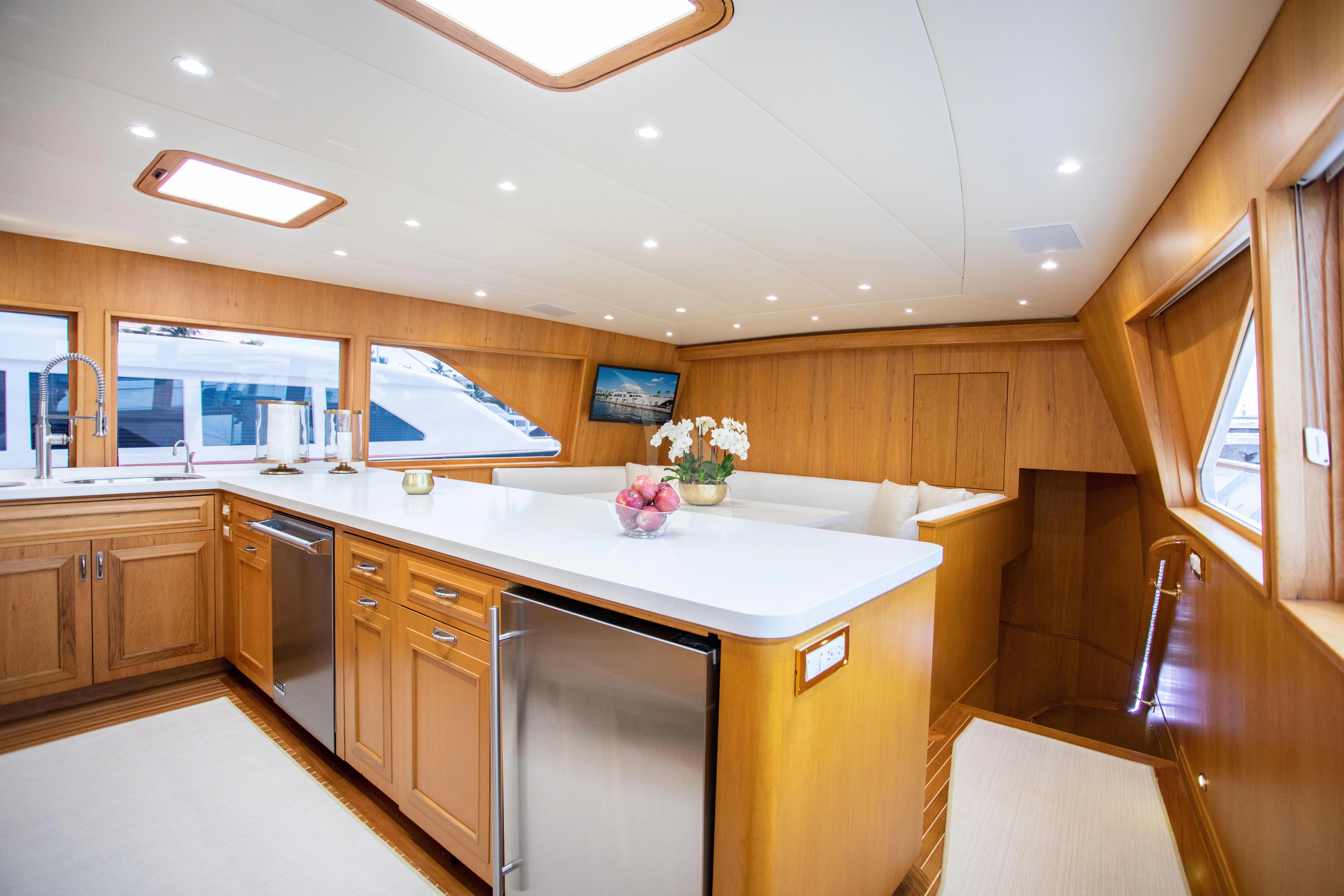 a kitchen with a large island aboard VIAGGIO Yacht for Sale