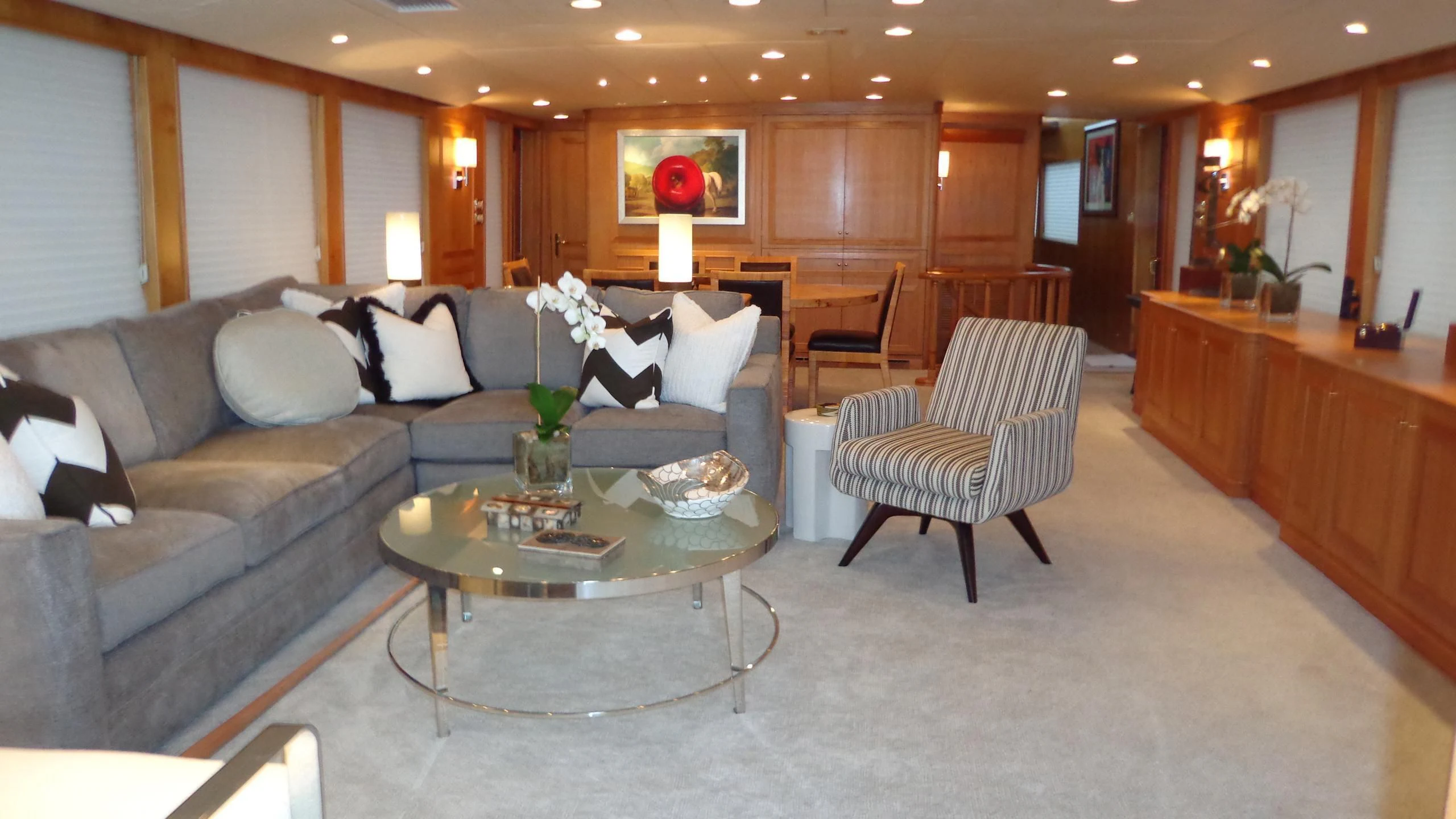 a living room with a couch and a coffee table aboard VIAGGIO Yacht for Sale