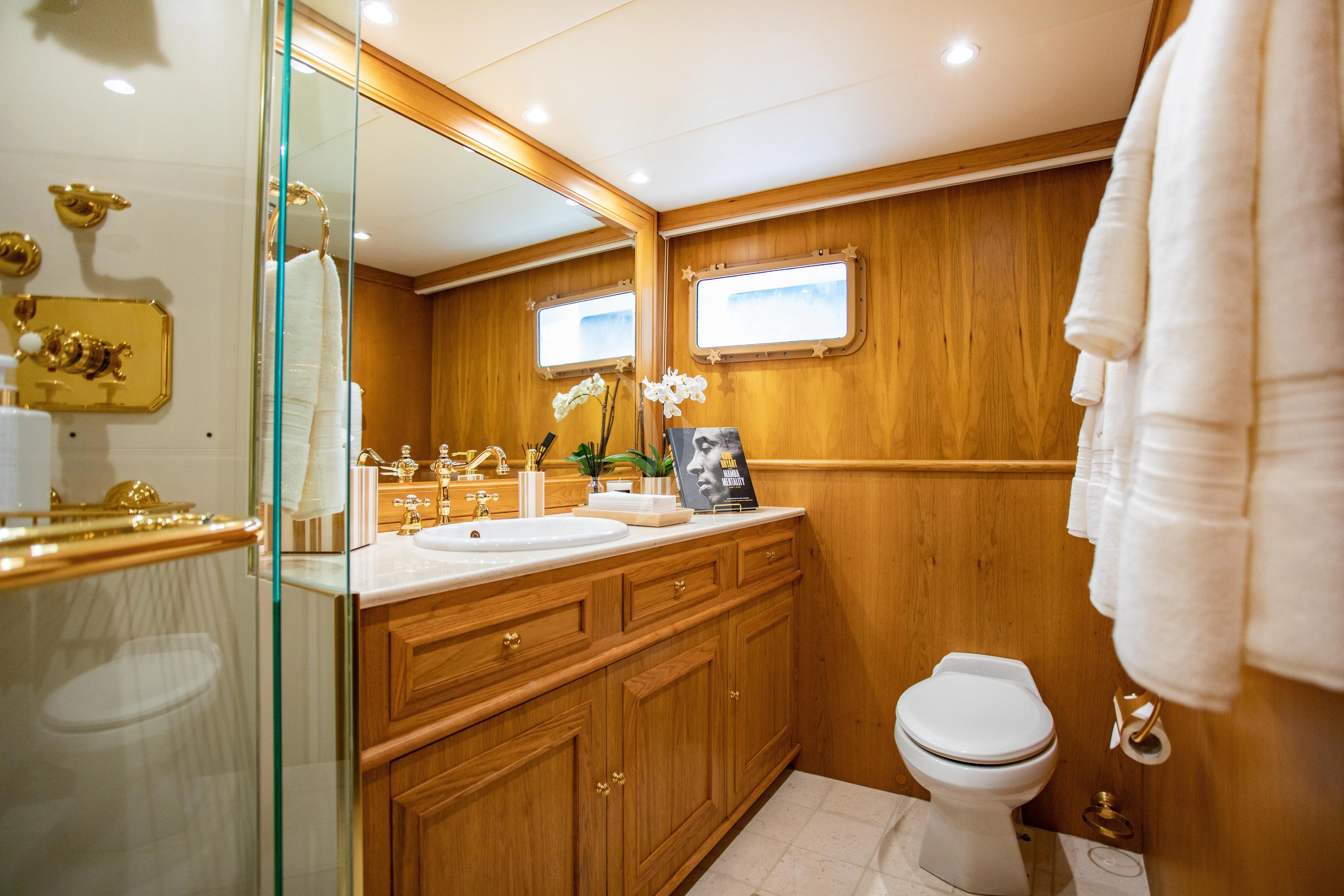 a bathroom with a glass shower aboard VIAGGIO Yacht for Sale