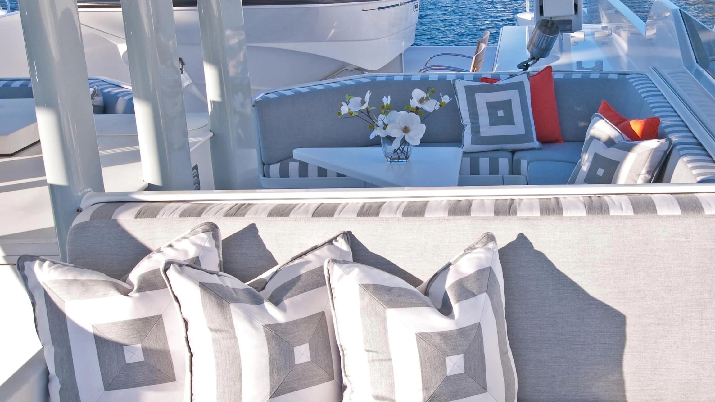 a room with a bed and pillows aboard VIAGGIO Yacht for Sale