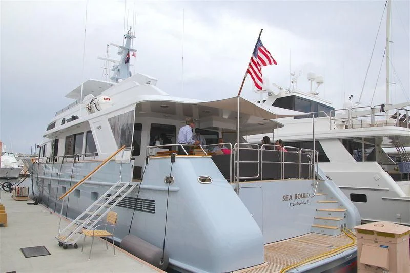 a boat with a flag on the front aboard VIAGGIO Yacht for Sale
