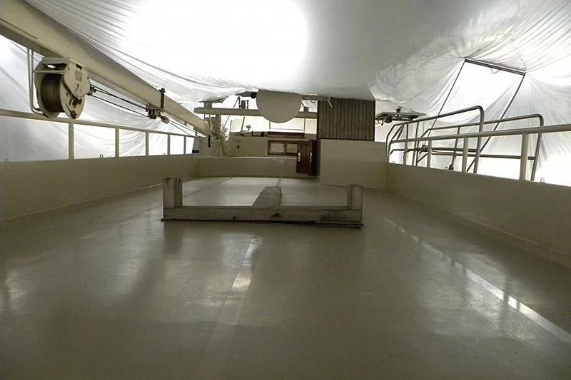 a large room with a few satellite dishes aboard TRINTEL Yacht for Sale