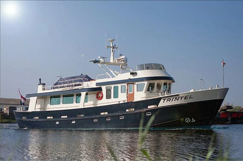 a large boat in the water aboard TRINTEL Yacht for Sale