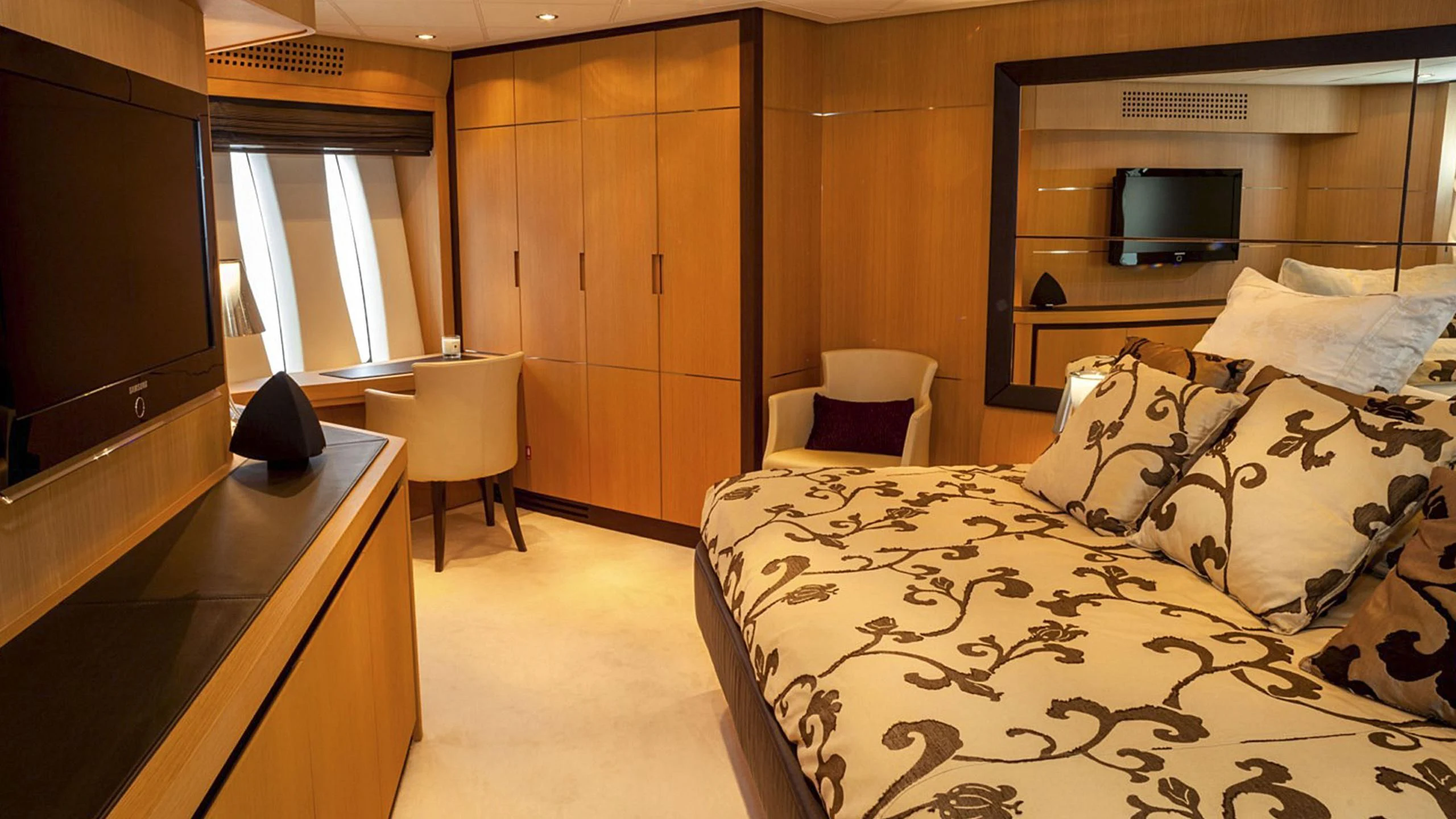 a bedroom with a bed and a tv aboard A&O Yacht for Sale