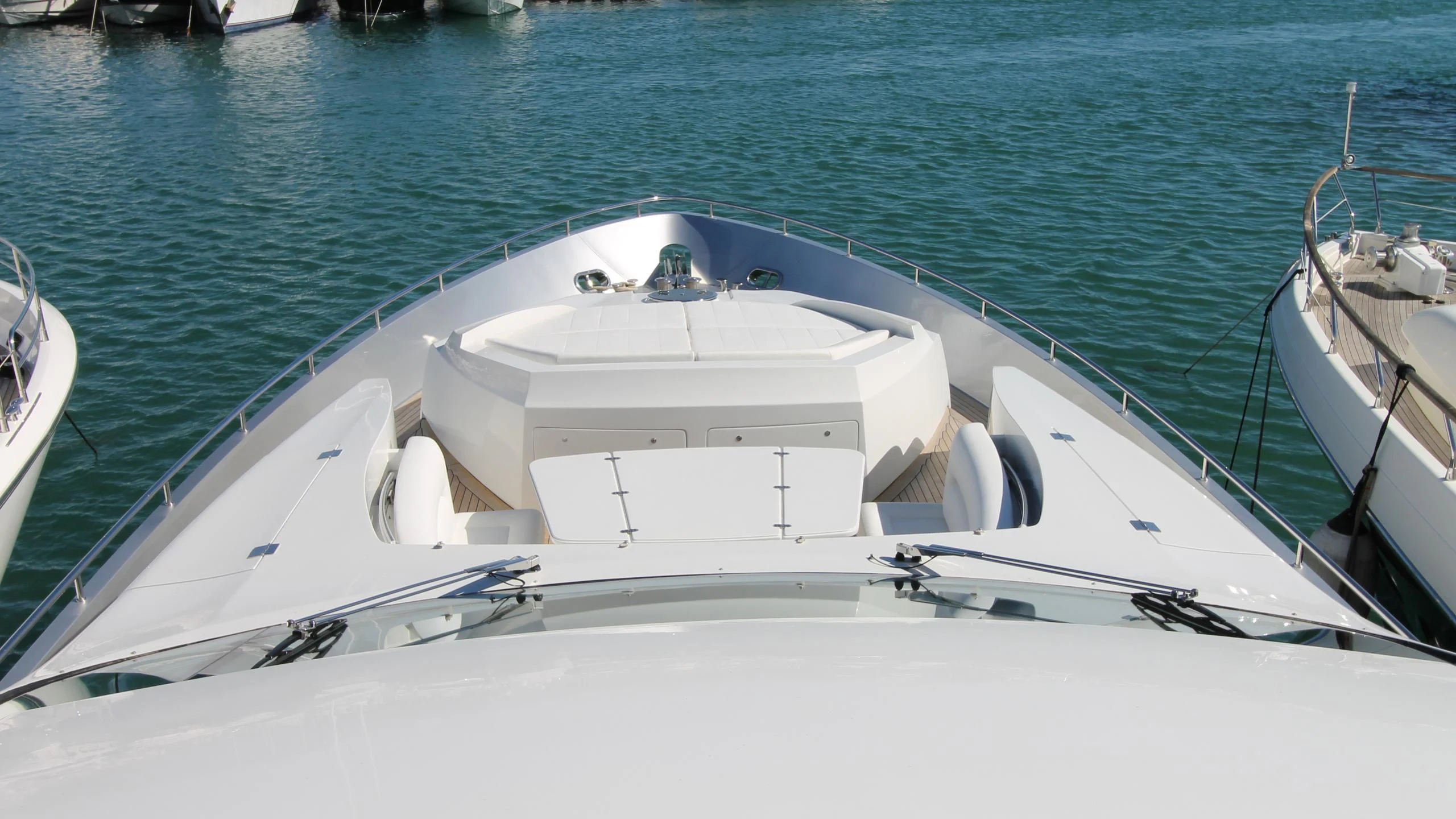 a white boat on a body of water aboard A&O Yacht for Sale