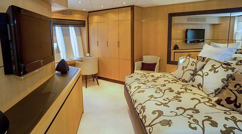 a room with a bed and a tv aboard A&O Yacht for Sale